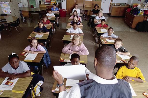 Teacher in a classroom during an on-site French lesson